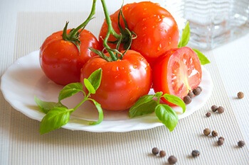 Tomatoes contain vitamins A and C essential for collagen production and nail growth