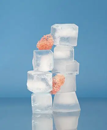 place a bag of ice on top of the mess and leaving it in place until the material hardens