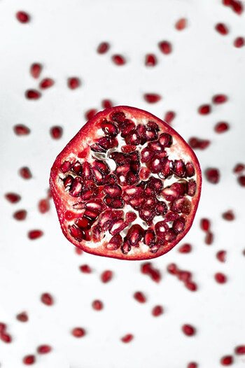 Grind pomegranate and mix with milk to make a scrub