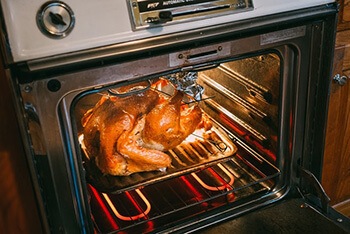 Scrub your oven with baking soda and vinegar