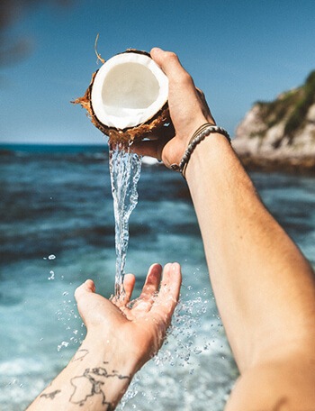 coconut water helps protect the stomach from harmful effects of excessive acid production