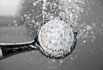 use vinegar to soak clogged shower head