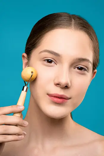 woman with face roller