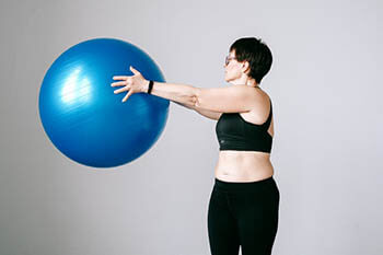 person exercising with an exercise ball