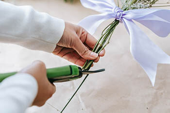person cutting stems