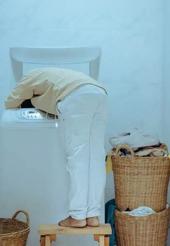 person doing laundry