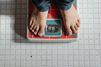 person on weighing scale