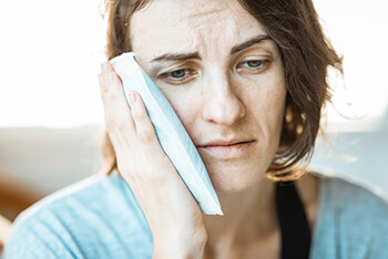 person holding a hot compress