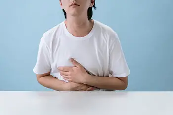 person clutching their stomach