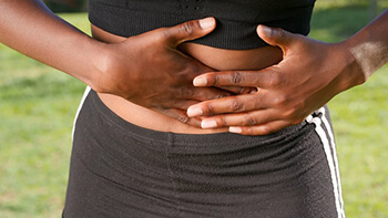 person holding abdomen